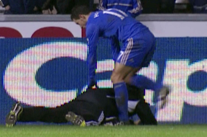 Eden Hazard kicks ball boy Charlie Morgan