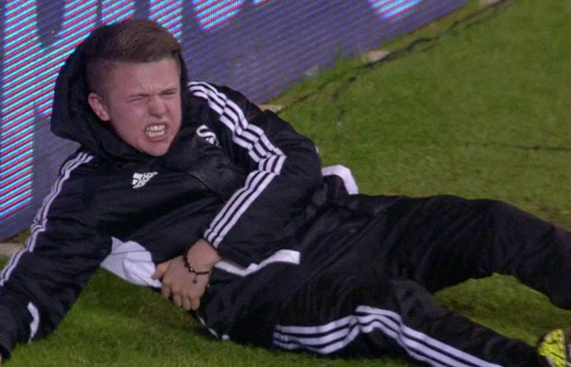 Eden Hazard kicks ball boy Charlie Morgan