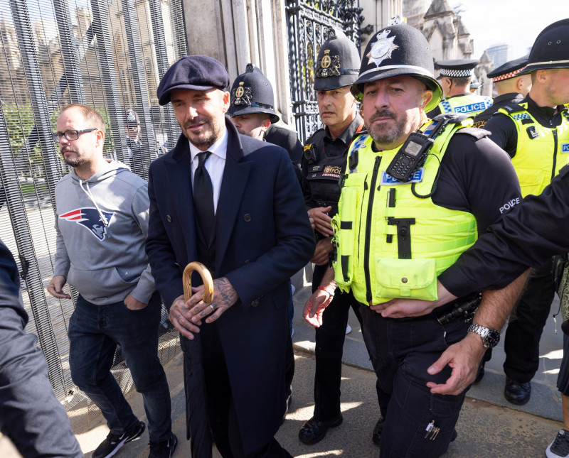 David Beckham Escorted By Policemen After Queuing 13 Hours To Pay His Respects To The Queen Lying In State