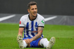 Berlin, Germany. 27th Aug, 2022. Soccer: Bundesliga, Hertha BSC - Borussia Dortmund, Matchday 4, Olympiastadion, Hertha's Stefan Jovetic pulls up his socks. Credit: Soeren Stache/dpa - IMPORTANT NOTE: In accordance with the requirements of the DFL Deutsch