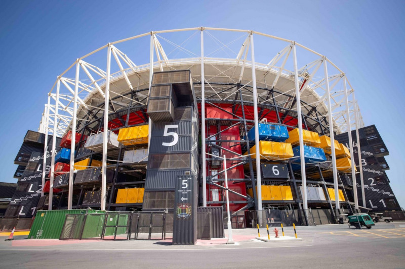 30 March 2022, Qatar, Doha: An exterior view shows the 974 stadium during a Fifa media tour. 974 colorfully arranged shipping containers were used to build the stadium. Doha will host the Fifa Congress on March 31 and the draw for the 2022 World Cup in Qa
