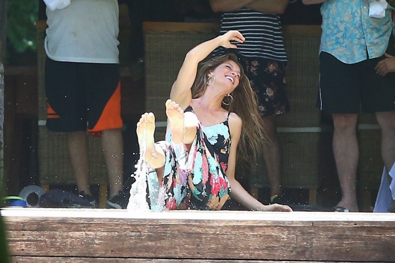 *EXCLUSIVE* Gisele Bundchen hops into the pool fully dressed for a playful photo shoot in Costa Rica