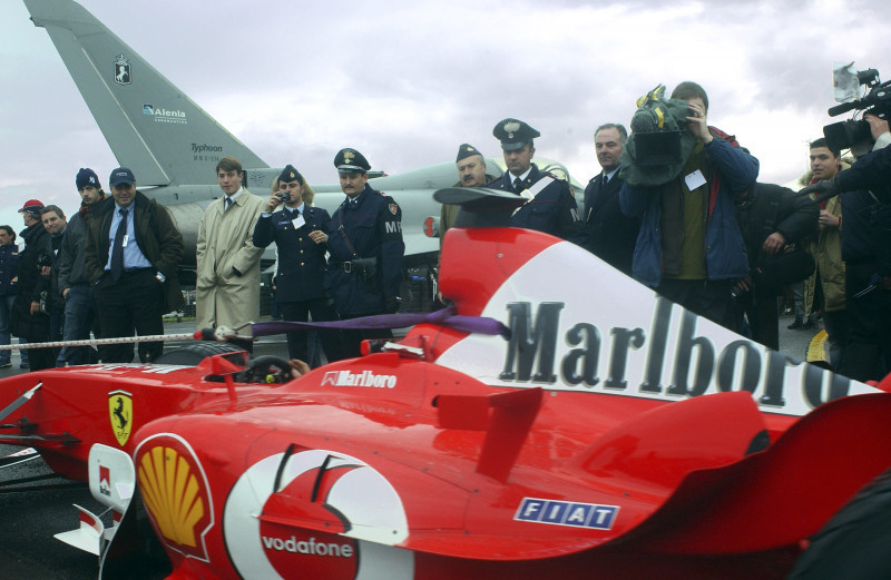 Michael Schumacher Of Ferrari Races Eurofighter Typhoon Aircraft