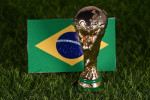 November 13, 2022, Doha, Qatar. FIFA World Cup trophy on the background of the flag of Brazil on the green lawn of the stadium.