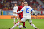 Gavi of Spain dribbles the ball and nutmegs Francisco Calvo of Costa Rica during the FIFA World Cup, WM, Weltmeistersch