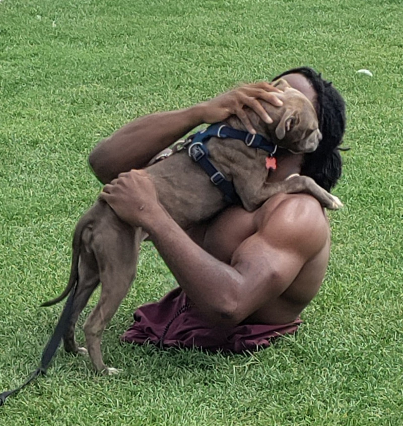 EXCLUSIVE: Strong Man Zion Clark An Inspirational Wrestler Plays With His Puppy At The Beach