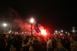 Fans wait for the arrival of the French national football team in Paris