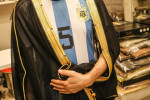 Football fans buy "Bisht" the traditional Arab cloak at a market in Doha, Qatar, Doha, Qatar - 21 Dec 2022