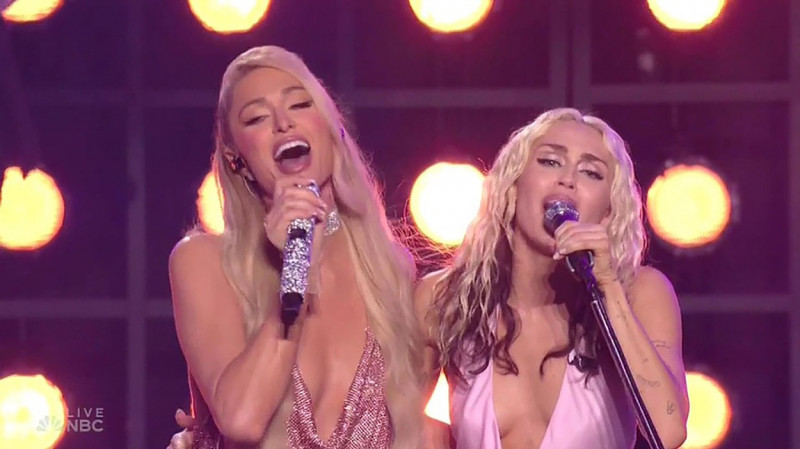 Paris Hilton makes surprise appearance on NBC’s New Year’s Eve show as she joins Miley Cyrus and Sia on stage