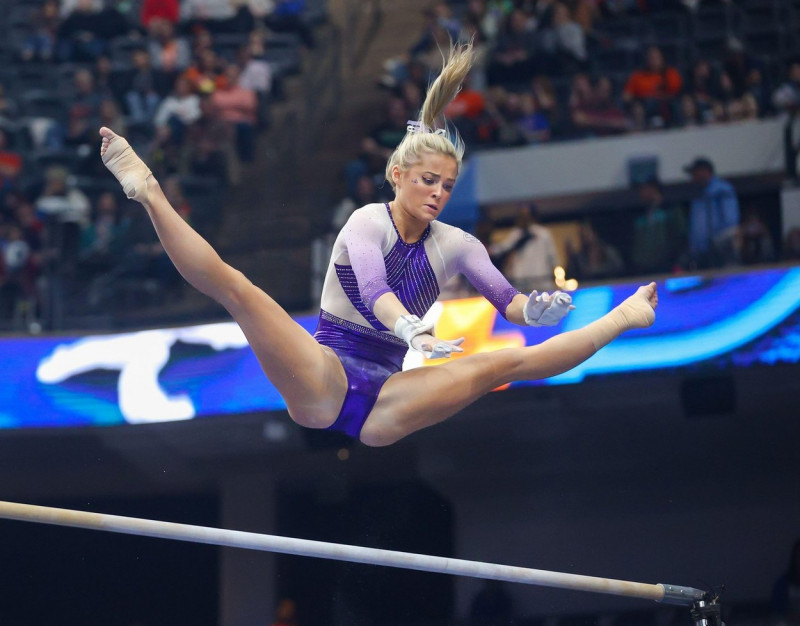 Birmingham, AL, USA. 19th Mar, 2022. LSU's Olivia Dunne on the uneven parallel bars during the 2022 SEC Women's Gymnastics Championships at Legacy Arena in Birmingham, AL. Kyle Okita/CSM/Alamy Live News
