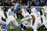Jacksonville, USA. 14th Jan, 2023. Quarterback Trevor Lawrence reaches over the end zone to score two points in the fourth quarter as the Chargers compete against the Jaguars in the NFL Wildcard Playoff game at the TIAA Bank Field in Jacksonville, Florida