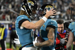 Jacksonville, USA. 14th Jan, 2023. Quarterback Trevor Lawrence (l) congratulates Wide Receiver Marvin Jones Jr after making a reception for a touchdown in the third quarter as the Chargers compete against the Jaguars in the NFL Wildcard Playoff game at th