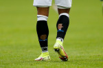 Holes in the socks of Josh Koroma #10 of Huddersfield Town