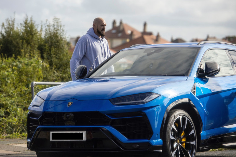 EXCLUSIVE: Tyson Fury Is Seen Out For A Walk And Driving His New 160k Blue Lamborghini Urus Ahead Of The Oleksandr Usyk V Anthony Joshua Fight