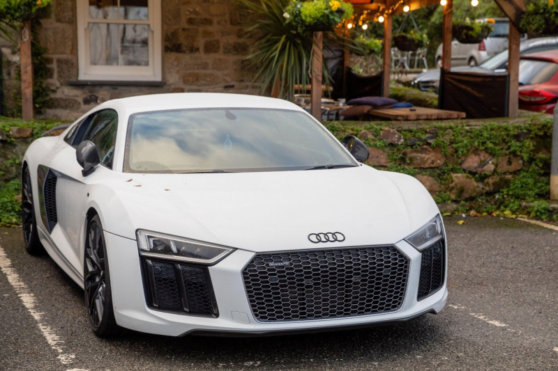 Penzance, Cornwall, 28th January 2022, A white Audi R8 parked in a car park in Penzance, Cornwall. The temperature was 10C but is forecast to be warmer over the weekend. Credit: Keith Larby/Alamy Live News