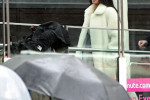 American reality TV Megastar Kim Kardashian pictured bearing the rainy London weather as she treats her seven-year-old son Saint to visit The London Eye.
