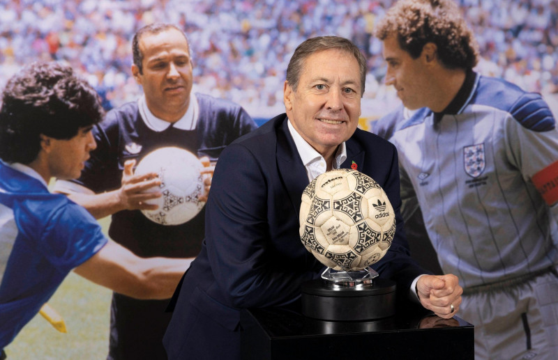 EDITORIAL USE ONLY Former English football player Kenny Sansom at an event at Wembley displaying the football used by Maradona to score the 'hand of God' goal at the 1986 World Cup quarter final between Argentina and England ahead of its auction later thi