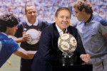 EDITORIAL USE ONLY Former English football player Kenny Sansom at an event at Wembley displaying the football used by Maradona to score the 'hand of God' goal at the 1986 World Cup quarter final between Argentina and England ahead of its auction later thi