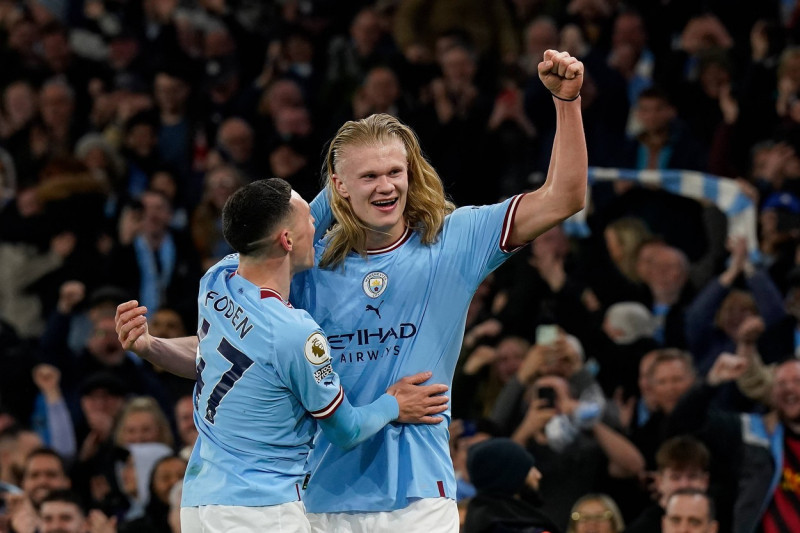 Manchester, England, 26th April 2023. Erling Haaland of Manchester City celebrates his goal with team mate Ben Foden dur