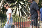 EXCLUSIVE: Basketball legend Michael Jordan is seen smoking a cigar while out for a walk his wife, Yvette Prieto in Marbella