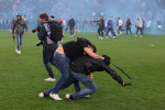 Udine, Italy, 4th May 2023. Rival fans clash following the final whistle of the Serie A match at Dacia Arena, Udine. Pic