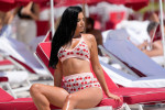 Ivana Knoll wears a cherry outfit to the beach in Miami