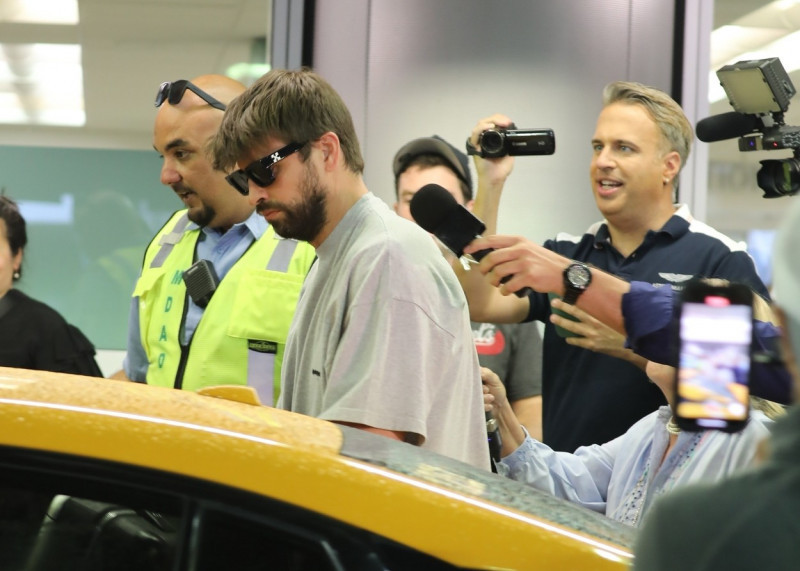 *EXCLUSIVE* Gerard Pique is ambushed by media as he arrives at Miami International Airport