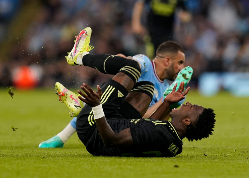 Manchester, England, 17th May 2023. Vinicius Junior of Real Madrid brought down by Kyle Walker of Manchester City during