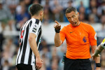 Newcastle United v Leicester City - Premier League Andre Marriner, Referee speaks to Fabian Schar of Newcastle United du