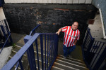 A Sunderland fan makes their way into the ground before the Sky Bet Championship play-off semi-final second leg match at Kenilworth Road, Luton. Picture date: Tuesday May 16, 2023.