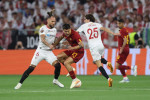 Budapest, Hungary, 31st May 2023. Paulo Dybala of AS Roma tackled by Nemanja Gudelj of Sevilla during the UEFA Europa Le
