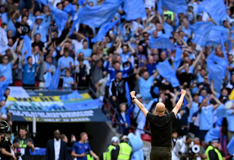 London, England, 3rd June 2023. Josep Guardiola manager of Manchester City celebrates the win in front of the City fans