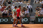 Serbia s Novak Djokovic embrace Spain s Carlos Alcaraz after he hurt himself during the men s singles match on semi-fina