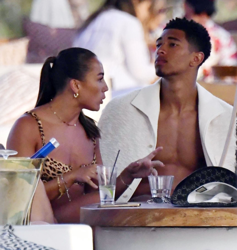 *EXCLUSIVE* WEB MUST CALL FOR PRICING - English footballer Jude Bellingham who is heavily linked with a move to Real Madrid is pictured chatting to some ladies while enjoying his summer vacation at SantAnna Beach Club in Mykonos.