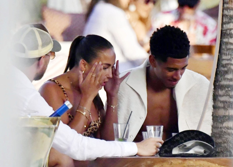 *EXCLUSIVE* WEB MUST CALL FOR PRICING - English footballer Jude Bellingham who is heavily linked with a move to Real Madrid is pictured chatting to some ladies while enjoying his summer vacation at SantAnna Beach Club in Mykonos.