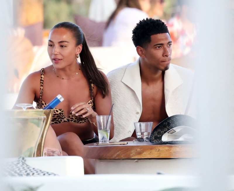 *EXCLUSIVE* WEB MUST CALL FOR PRICING - English footballer Jude Bellingham who is heavily linked with a move to Real Madrid is pictured chatting to some ladies while enjoying his summer vacation at SantAnna Beach Club in Mykonos.