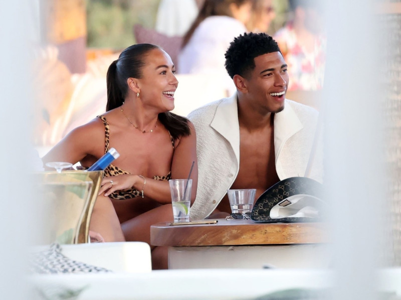 *EXCLUSIVE* WEB MUST CALL FOR PRICING - English footballer Jude Bellingham who is heavily linked with a move to Real Madrid is pictured chatting to some ladies while enjoying his summer vacation at SantAnna Beach Club in Mykonos.