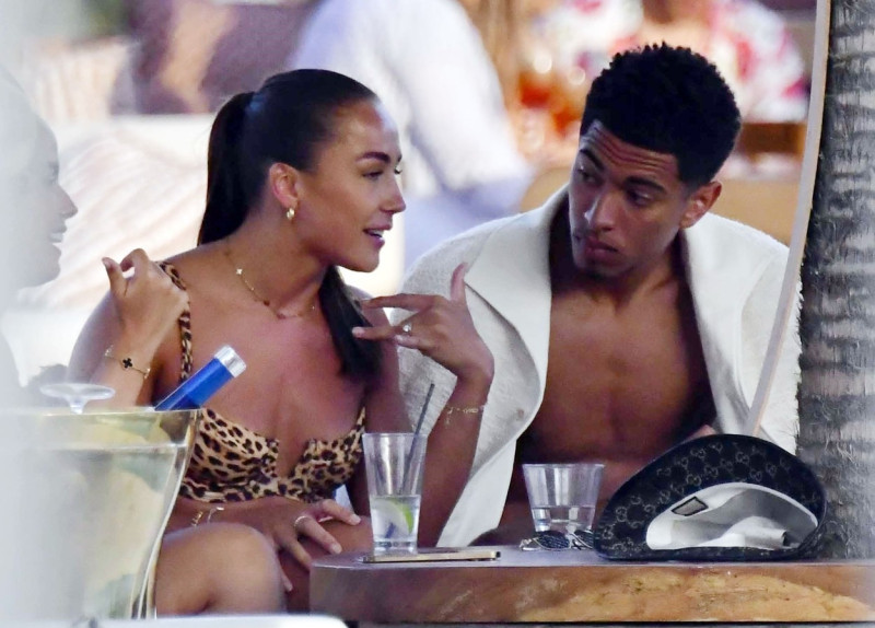 *EXCLUSIVE* WEB MUST CALL FOR PRICING - English footballer Jude Bellingham who is heavily linked with a move to Real Madrid is pictured chatting to some ladies while enjoying his summer vacation at SantAnna Beach Club in Mykonos.