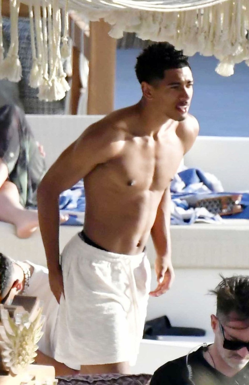 *EXCLUSIVE* WEB MUST CALL FOR PRICING - English footballer Jude Bellingham who is heavily linked with a move to Real Madrid is pictured chatting to some ladies while enjoying his summer vacation at SantAnna Beach Club in Mykonos.