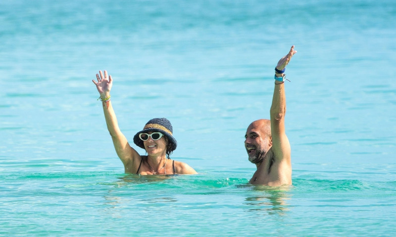 *PREMIUM-EXCLUSIVE* MUST CALL FOR PRICING BEFORE USAGE - Manchester City's title-winning manager Pep Guardiola and wife Cristina Serra pack on the PDA while relaxing on Holiday in Barbados.*PICTURES TAKEN ON 22/06/2022*