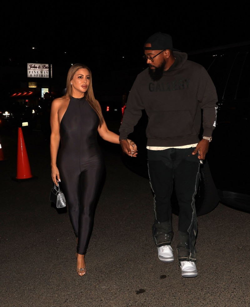 Larsa Pippen and beau Marcus Jordan hold hands arriving for dinner at Catch Steak!