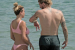 The Italian sports presenter Diletta Leotta showcases her ever-growing baby bump spotted out on the beaches of Ibiza with her beau, the Newcastle goalkeeper Loris Karius.