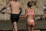 The Italian sports presenter Diletta Leotta showcases her ever-growing baby bump spotted out on the beaches of Ibiza with her beau, the Newcastle goalkeeper Loris Karius.