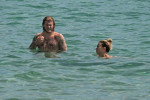 The Italian sports presenter Diletta Leotta showcases her ever-growing baby bump spotted out on the beaches of Ibiza with her beau, the Newcastle goalkeeper Loris Karius.