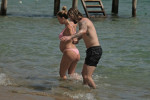 The Italian sports presenter Diletta Leotta showcases her ever-growing baby bump spotted out on the beaches of Ibiza with her beau, the Newcastle goalkeeper Loris Karius.