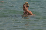 The Italian sports presenter Diletta Leotta showcases her ever-growing baby bump spotted out on the beaches of Ibiza with her beau, the Newcastle goalkeeper Loris Karius.