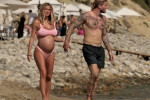 The Italian sports presenter Diletta Leotta showcases her ever-growing baby bump spotted out on the beaches of Ibiza with her beau, the Newcastle goalkeeper Loris Karius.