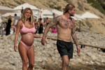 The Italian sports presenter Diletta Leotta showcases her ever-growing baby bump spotted out on the beaches of Ibiza with her beau, the Newcastle goalkeeper Loris Karius.