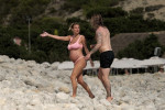 The Italian sports presenter Diletta Leotta showcases her ever-growing baby bump spotted out on the beaches of Ibiza with her beau, the Newcastle goalkeeper Loris Karius.