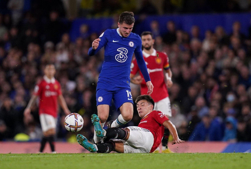 Chelsea's Mason Mount (left) and Manchester United's Lisandro Martinez battle for the ball during the Premier League match at Stamford Bridge, London. Picture date: Saturday October 22, 2022.